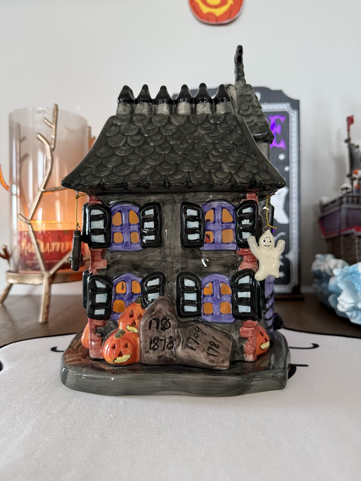 Ceramic Haunted House Luminary by JCPenney — left